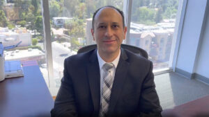 anthony girgis apc at desk at his law firm 1200